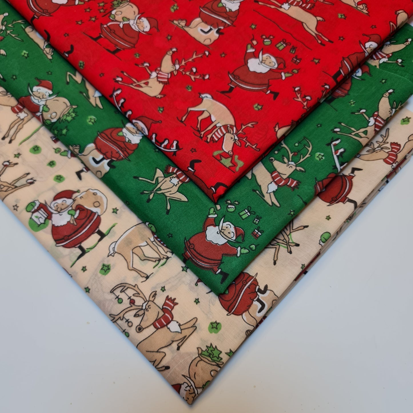 xmas material by the metre with santa and reindeer pattern