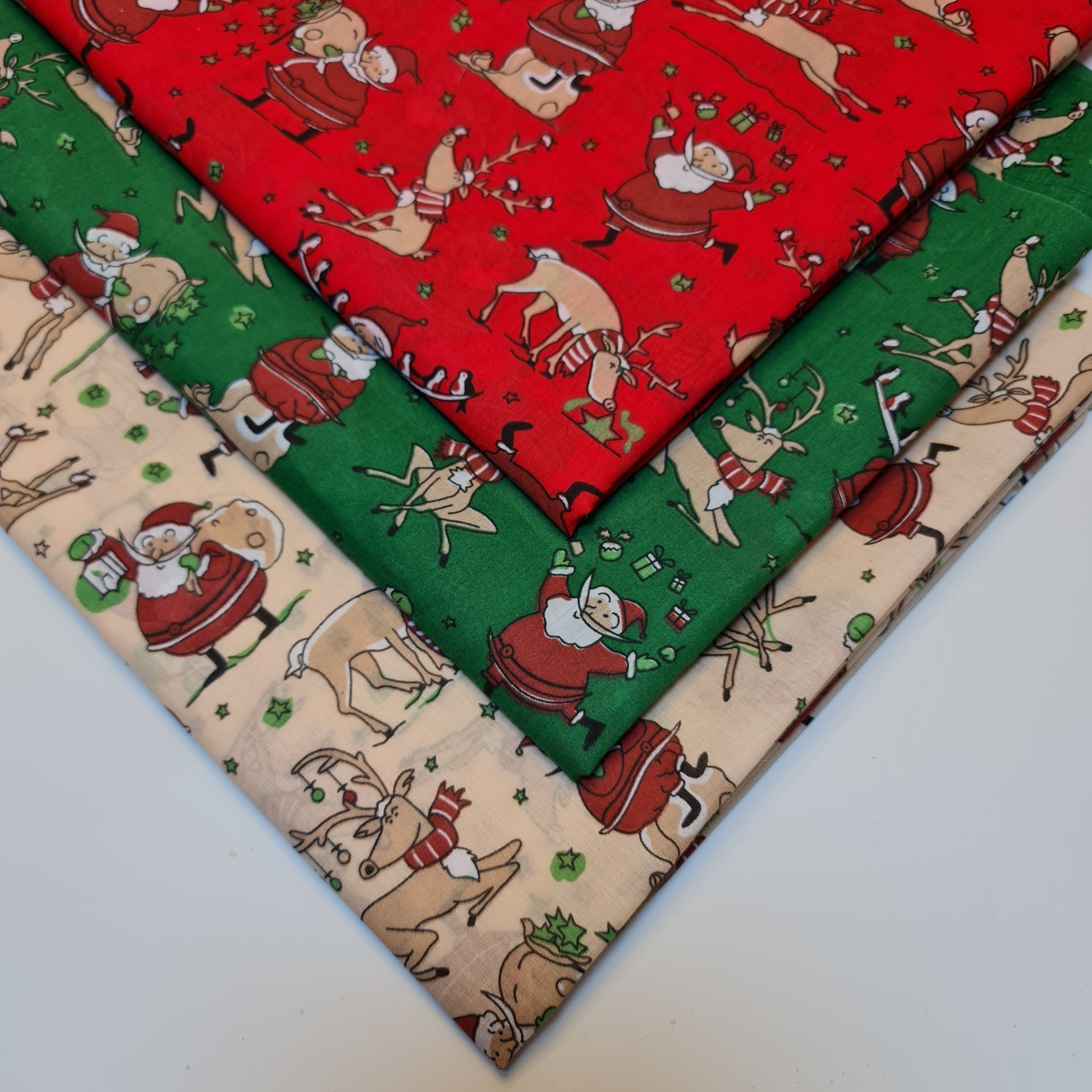 xmas material by the metre with santa and reindeer pattern