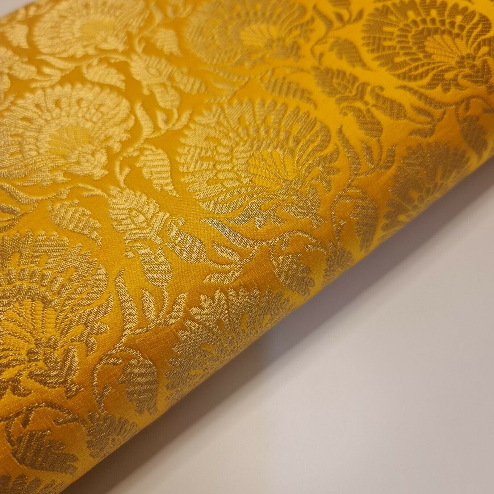 yellow brocade material with floral print