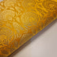 yellow brocade material with floral print
